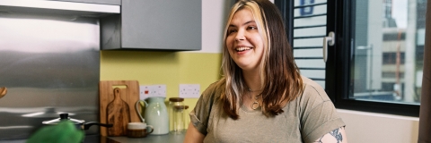 A student in a kitchen in halls