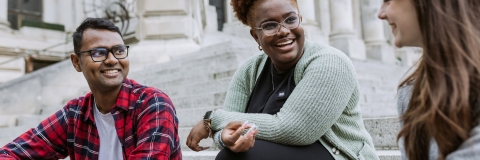 Three people laughing and talking 
