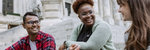 Three people laughing and talking 