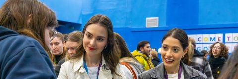 Three students talking to each other