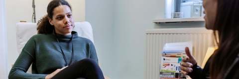 Two women talking in a therapy setting
