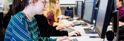 Female University of Portsmouth student working in computer lab