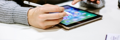 Female academic using a tablet with pencil 