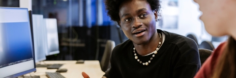 Students talking whilst sat at computer desksTechnology Facilities Day One - NOT FOR THIRD PARTY - CONSENT