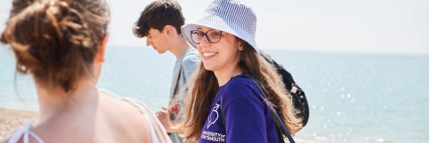 Students walking along the beach at Southsea in summer