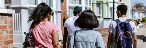 Group of three students walking down Portsmouth road