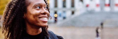 Smiling international student outside the Guildhall