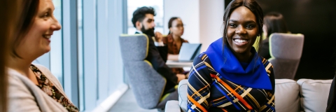 Smiling student in library in placements meeting