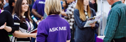 Postgraduate students and staff at an open evening