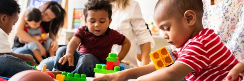 Children playing with toy bricks