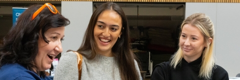 Students and staff laughing together