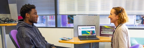 A student speaking to a careers adviser