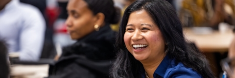 Two students, one laughing