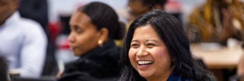 Two students, one laughing