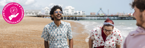 Student Life hero image showing a two students on Southsea beach