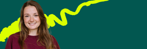 A female student wearing a red top against a dark green background