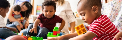 Children playing with toy bricks