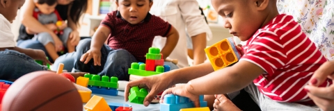 Children playing with toy bricks