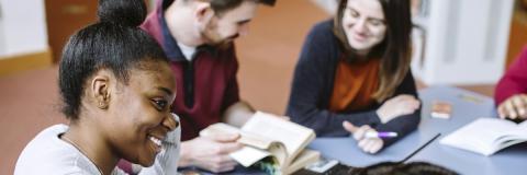 Female University of Portsmouth student studying with friends
