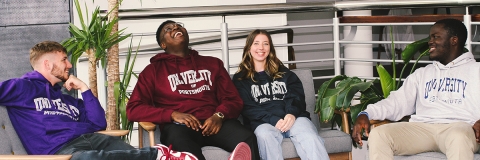 Four Students' Union Elected Officers sitting and smiling