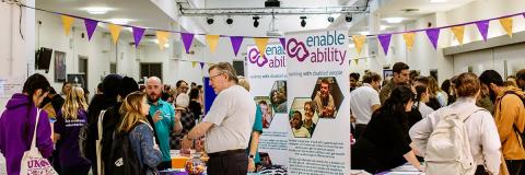students speaking to employers at a volunteering fair
