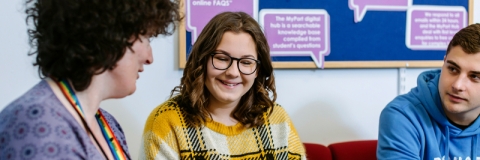 University Student Finance staff advising a student