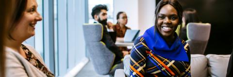 Smiling student in library in placements meeting
