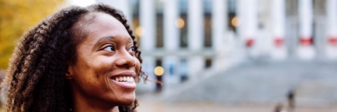 Smiling international student outside the Guildhall