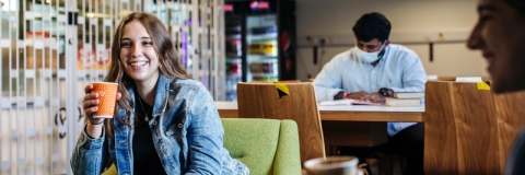 Students sharing a coffee in the University of Portsmouth Library