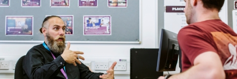 Staff discussing issues with a student