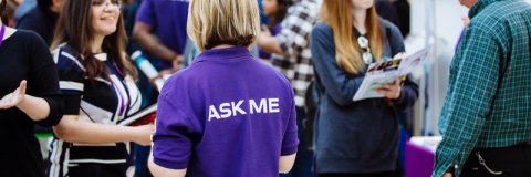Postgraduate students and staff at an open evening