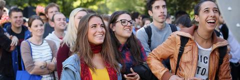 International students standing in a group and smiling