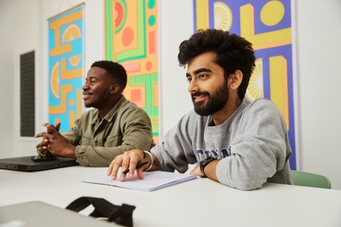 Two men studying in a group