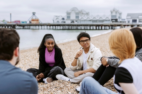 Students enjoying Southsea beach
