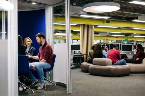 Groups of students studying in the library