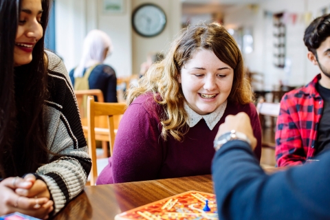 Students playing board games