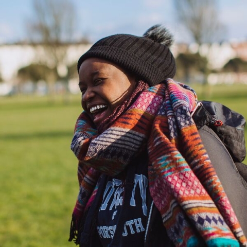 Student laughing outside in autumn