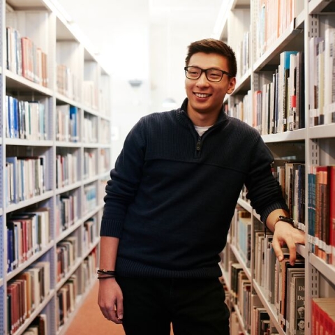 Student-smiling-in-library