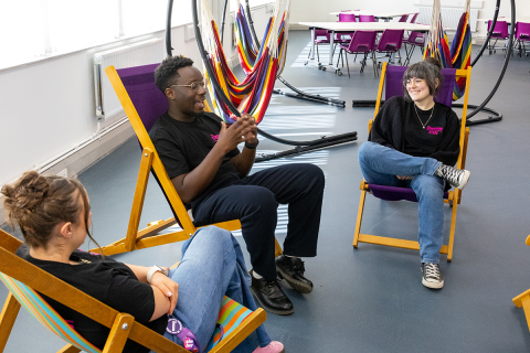 Students relaxing on deckchairs in The Space 