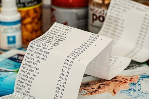 Shopping receipt in front of grocery shopping