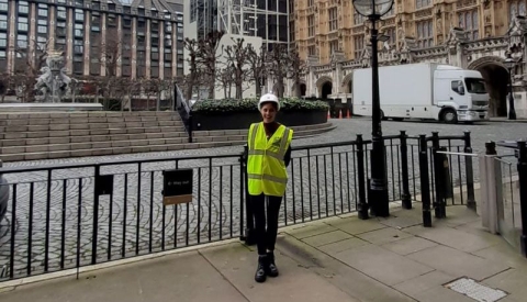 Student in front of the House of Commons