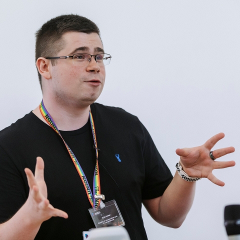 Photo of Kris Nolan speaking at event.- Festival of Doctoral Research