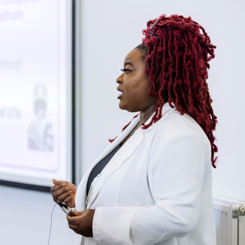 Photo of Rachael Odunmbaku speaking at event.- Festival of Doctoral ResearchFOR GRADUATE SCHOOL USE ONLY