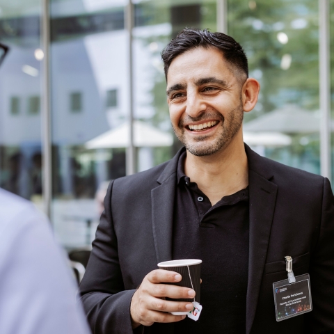 Photo of Charlie Pericleous smiling and talking outside- Festival of Doctoral ResearchNOT FOR THIRD PARTY CONSENTFOR GRADUATE SCHOOL USE ONLY
