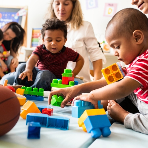 Children playing with toy bricks