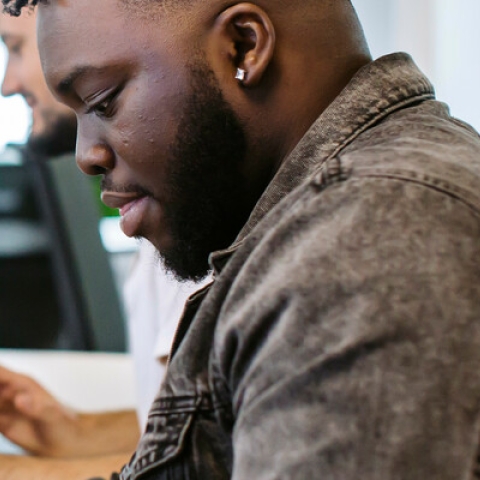 Students writing assignments in Library and referencing
