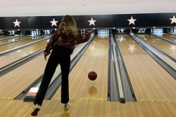 image of the back of a student at a bowling alley