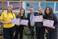 Students with Kevin Poulter, holding their certificates