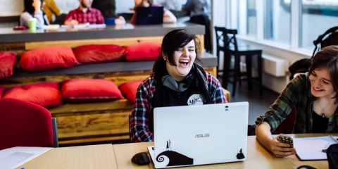 Students laughing and studying in Eldon cafe