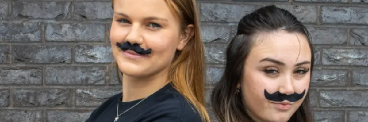 Movember: girls wearing moustaches